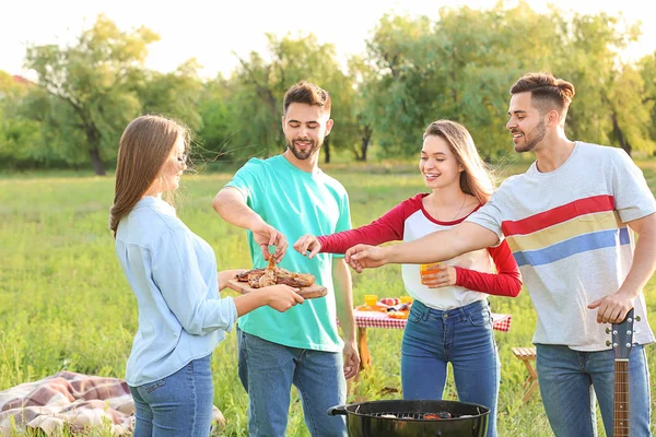 Friends at barbecue party outdoors — Stock Photo, Image