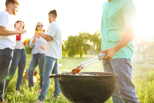 Friends at barbecue party outdoors — Stock Photo, Image