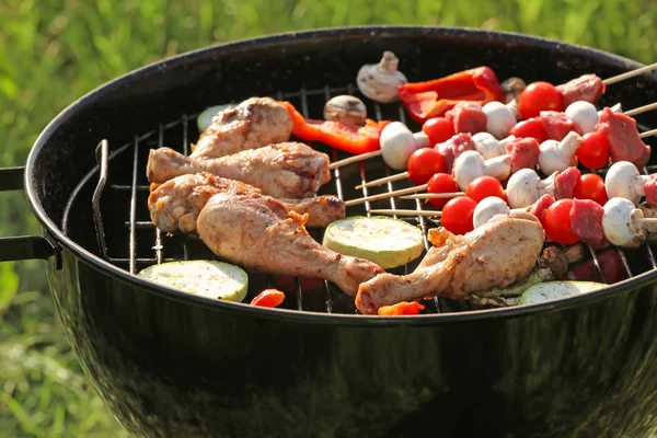 Cooking of tasty food on barbecue grill outdoors, closeup — Stock Photo, Image