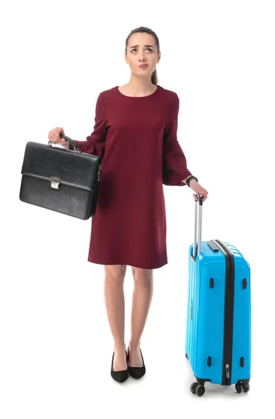 Nachdenkliche Geschäftsfrau mit Aktentasche und Gepäck auf weißem Hintergrund — Stockfoto