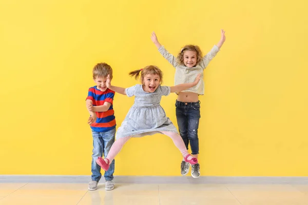 Cute little children having fun near color wall — Stock Photo, Image