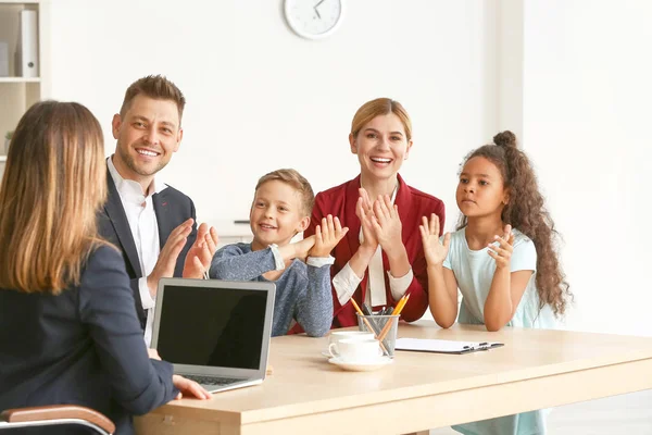 Happy family after signing adoption documents during meeting with social worker — Stock Photo, Image