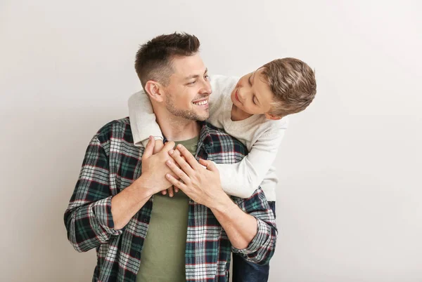 Happy man with little adopted boy on white background — Stock Photo, Image