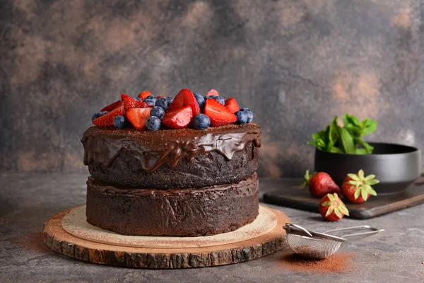 Tasty chocolate cake on grey table — Stock Photo, Image