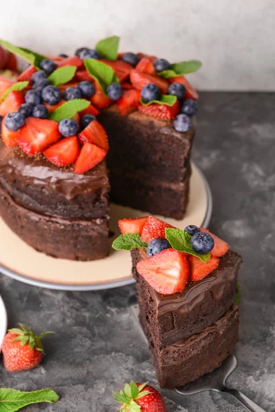 Tasty chocolate cake on grey table — Stock Photo, Image