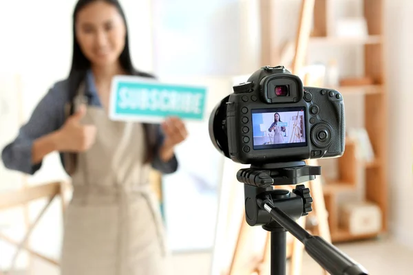 Female Asian blogger recording video in workshop — Stock Photo, Image