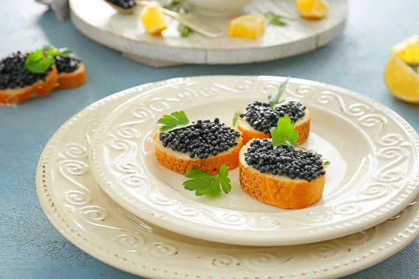 Sandwiches with black caviar on table — Stock Photo, Image
