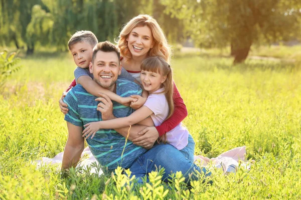 Happy family resting in park — Stock Photo, Image