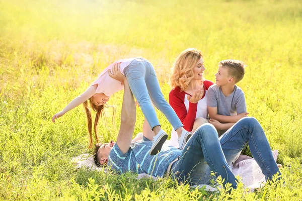 Happy family resting in park — Stock Photo, Image
