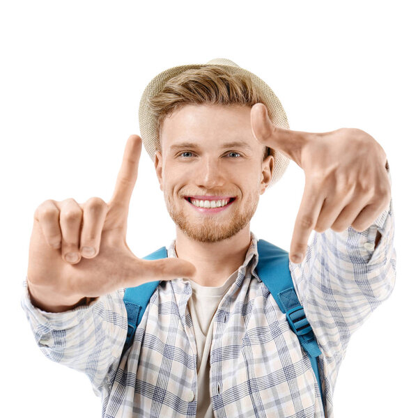 Young tourist making frame shape with hands on white background