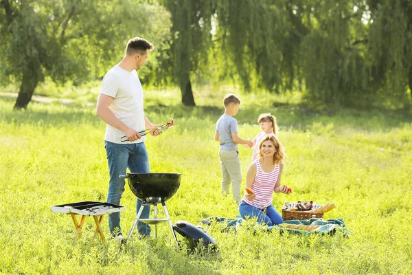 Happy family on summer picnic in park — Stock Photo, Image