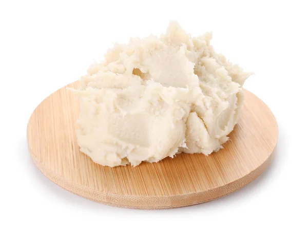 Board with shea butter on white background — Stock Photo, Image