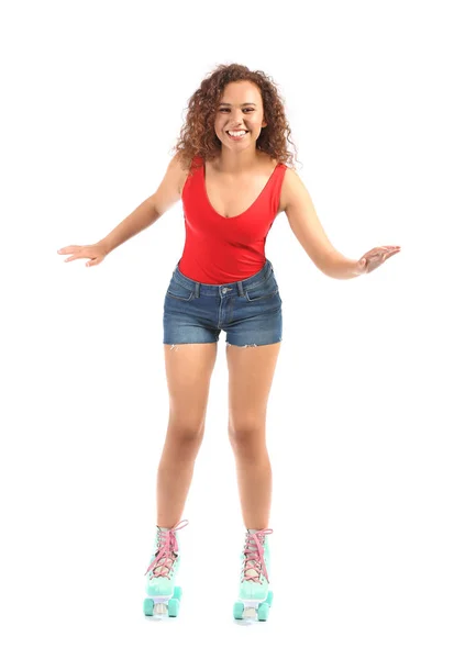 Mulher bonita em patins contra fundo branco — Fotografia de Stock