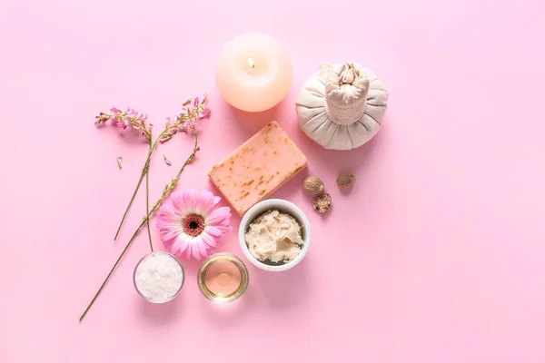 Shea butter with cosmetic products and candle on color background — Stock Photo, Image