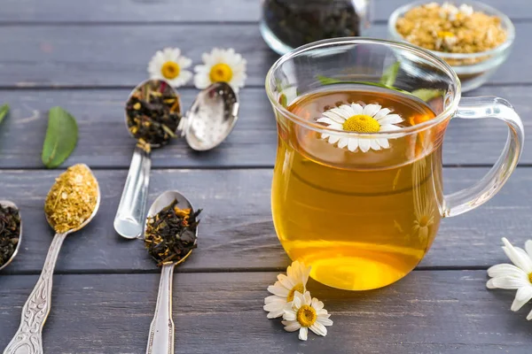 Cup of tasty chamomile tea on wooden table — Stock Photo, Image