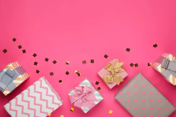Beautiful gift boxes on color background — Stock Photo, Image