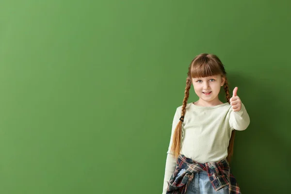 Cute deaf mute girl using sign language on color background — Stock Photo, Image