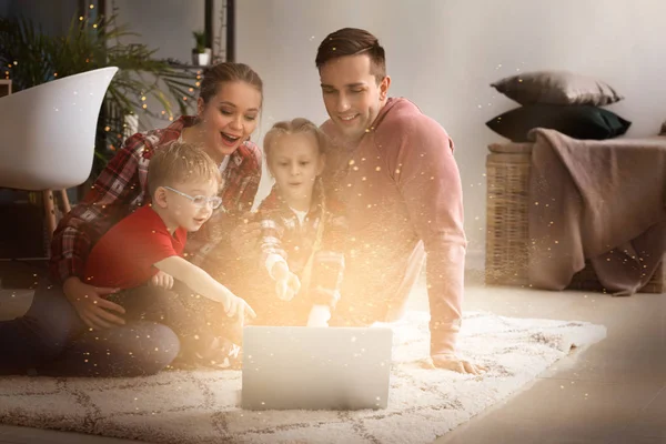 Happy family watching cartoons at home — Stock Photo, Image