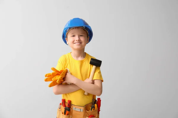 Cute little worker on white background — Stock Photo, Image