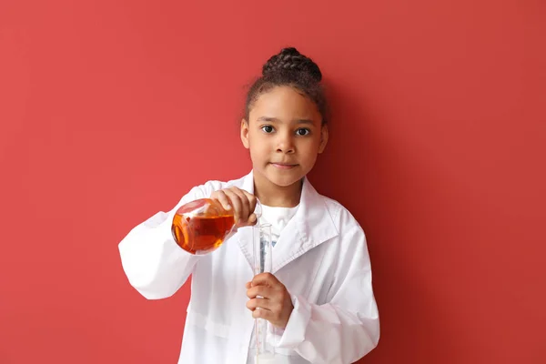 Little African-American scientist on color background — Stock Photo, Image