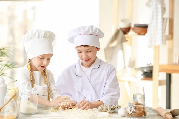 Cute little chefs cooking in kitchen — Stock Photo, Image