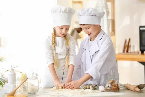Cute little chefs cooking in kitchen — Stock Photo, Image