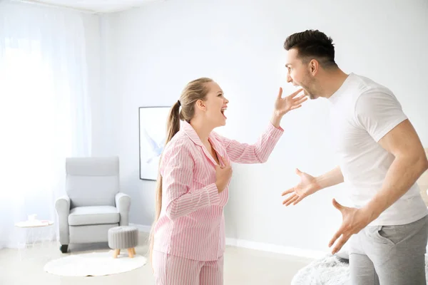 Young couple quarrelling in bedroom — Stock Photo, Image