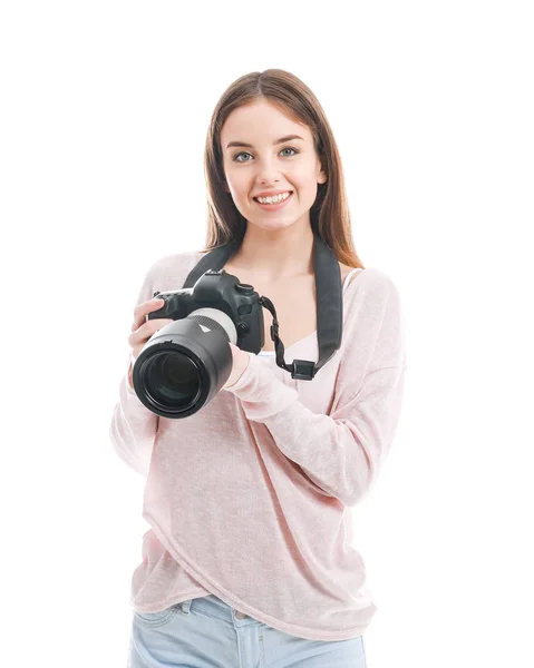Young female photographer on white background — Stock Photo, Image