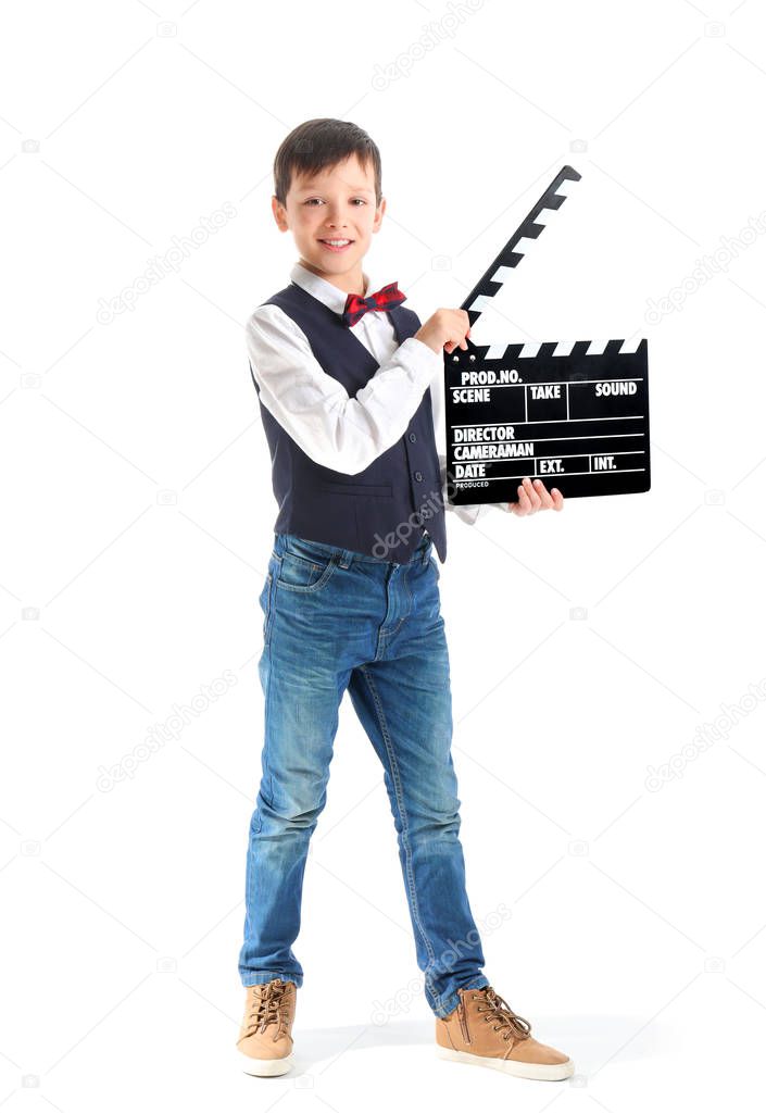 Little boy with clapperboard on white background