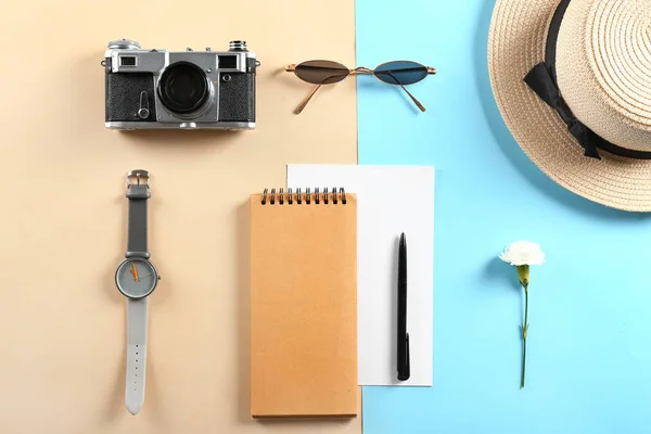 Photo camera, sunglasses, notebook, watch and hat on color background — Stock Photo, Image
