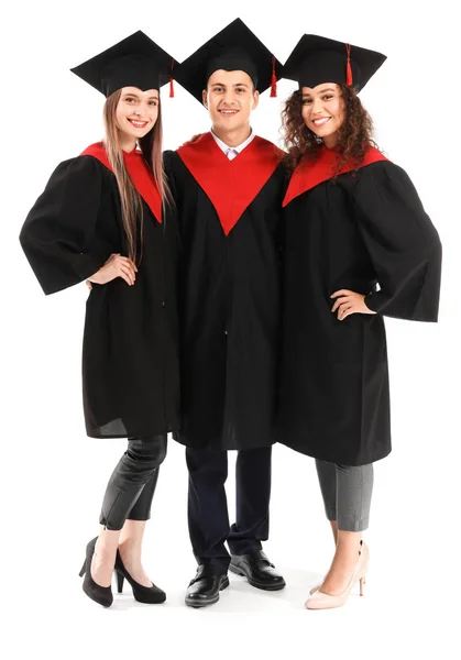 Young students in bachelor robes on white background — Stock Photo, Image