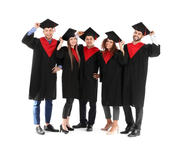Fiatal diákok a Bachelor köpenyben fehér alapon — Stock Fotó