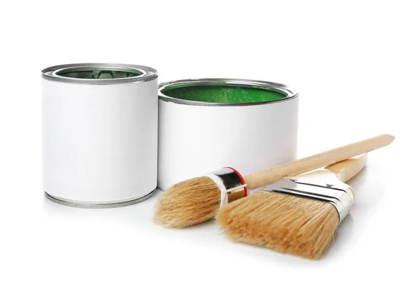 Cans of paint and brushes on white background — Stock Photo, Image