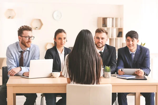 Human resources commission interviewing woman in office