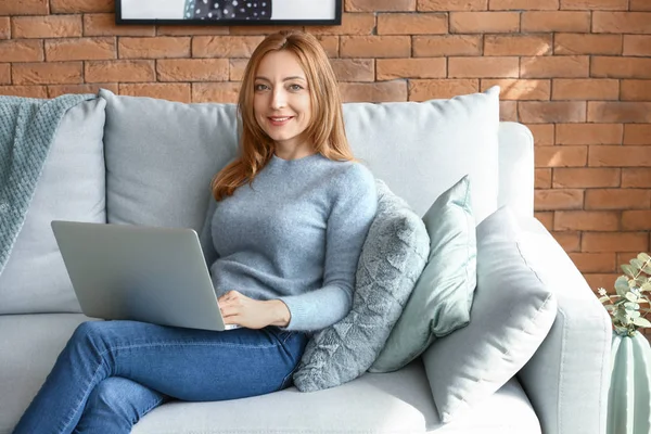 Portrait of mature woman working on laptop at home — Stock Photo, Image