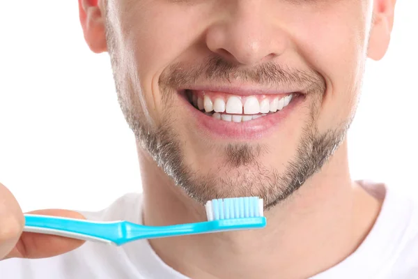 Man cleaning teeth on white background, closeup — Stock Photo, Image