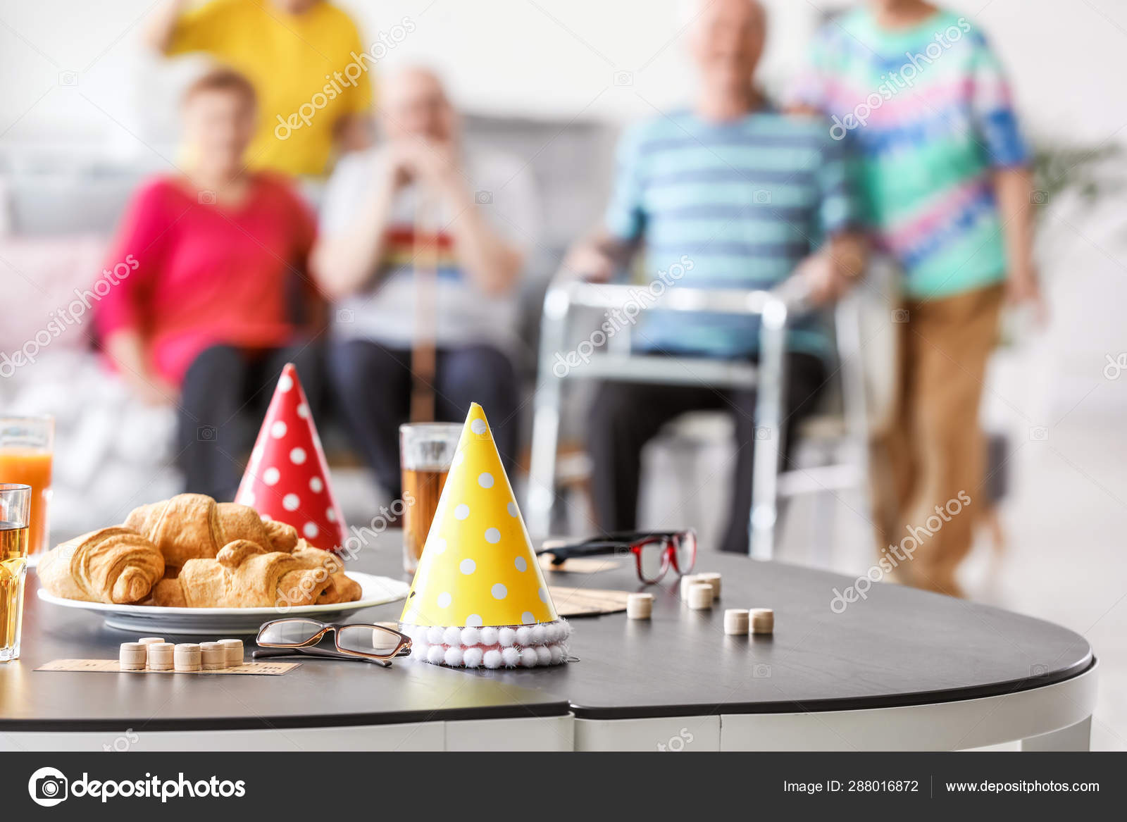 Table With Party Decor And Bingo Game On Table In Nursing Home