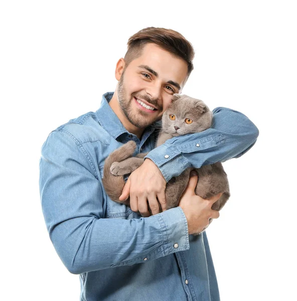 Young man with cute funny cat on white background — Stock Photo, Image