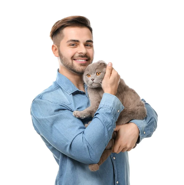 Young man with cute funny cat on white background — Stock Photo, Image