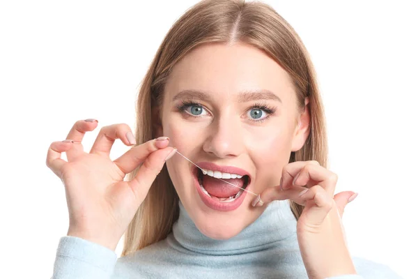 Woman flossing teeth on white background — Stock Photo, Image