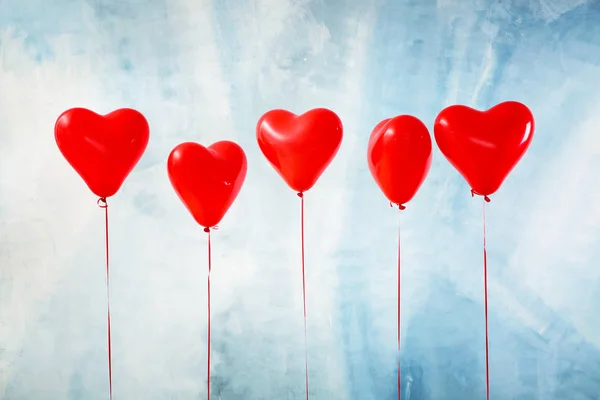 Heart-shaped air balloons on color background — Stock Photo, Image