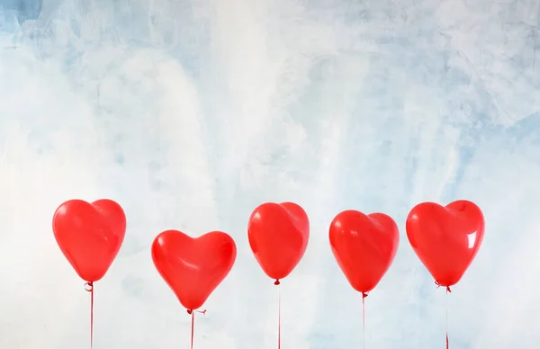 Heart-shaped air balloons on color background — Stock Photo, Image