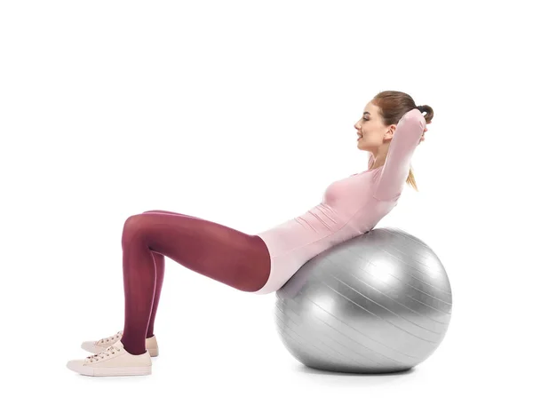 Young sporty woman doing exercises with fitball on white background — Stock Photo, Image