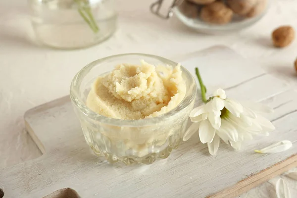 Bowl with shea butter on table — Stock Photo, Image