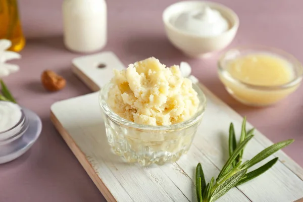 Bowl with shea butter on table — Stock Photo, Image