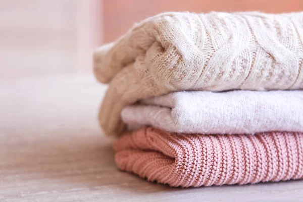 Stack of clean clothes on table, closeup — Stock Photo, Image