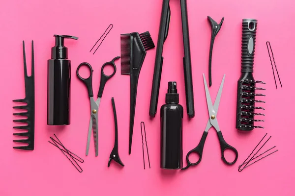 Set of hairdresser tools and accessories on color background