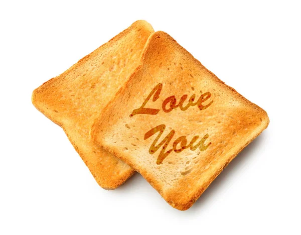 Toasted bread with inscription LOVE YOU on white background — Stock Photo, Image