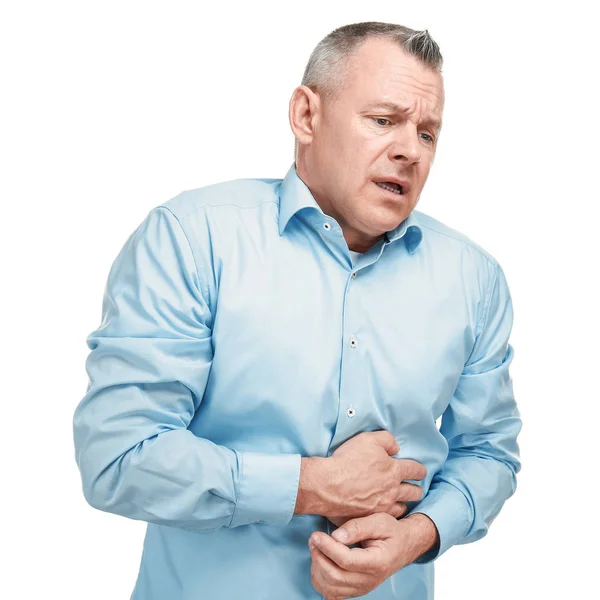 Handsome middle-aged man suffering from stomach ache on white background — Stock Photo, Image