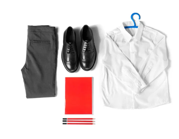 Schooluniform en briefpapier op witte achtergrond — Stockfoto